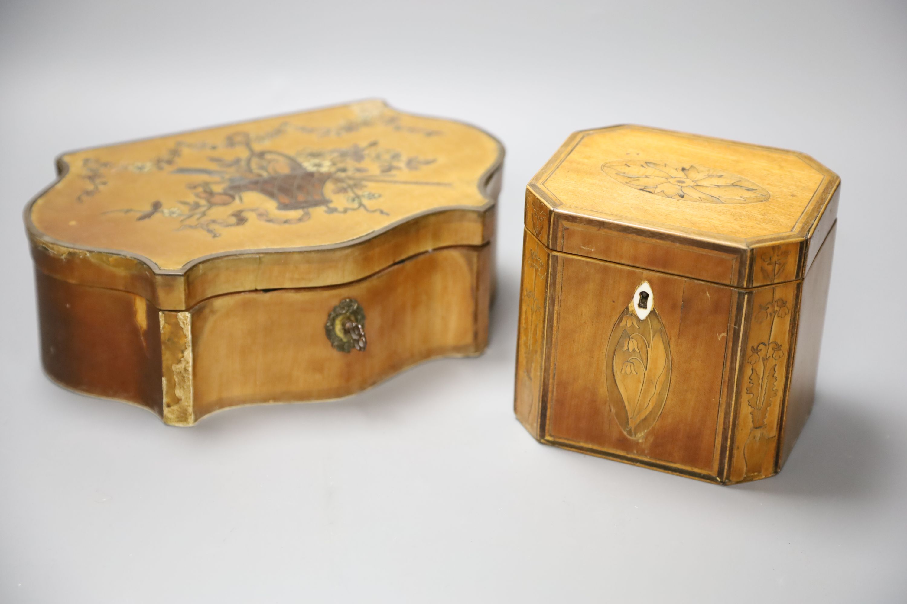 A marquetry serpentine work box, length 23.5cm, and an octagonal tea caddy